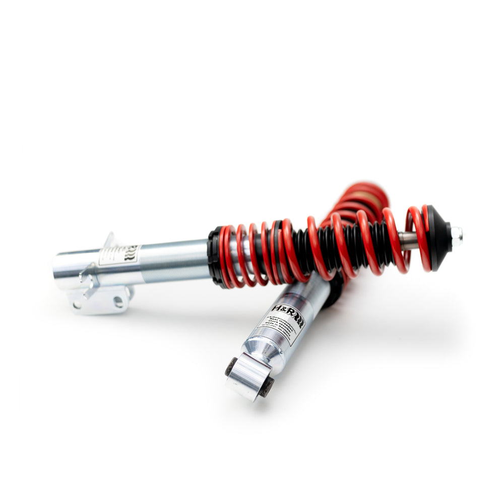 zwei übereinander-liegende, rot-silberne Gewindefahrwerke der Marke H&R Spezialfedern, passend für Porsche 911